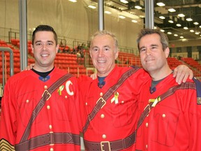 Staff Sgt. Jeremie Landry’s father Frank (middle) and older brother Hayden
(right) have been making an annual pilgrimage to Cold Lake to play in the
RCMP vs. Fire Rescue charity hockey game over the last few years.