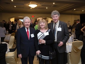 Dennis Duce (right),  winner of the David Baxter Memorial Award for outstanding individual achievementa at the Chamber of Commerce Brantford-Brant's annual business excellence award Thursday night, is joined by his wife, Debbie Duce, and his brother, Bill Duce. (Photohouse Photography)