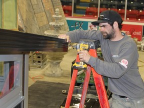 Daniel Dupéré helps construct a Sunspace Sunroom which will be part of Northern Windows and Doors display on the floor of the McIntyre Arena during the Timmins Construction Association’s 29th-annual Home and Cottage Show taking place this weekend. The show kicks off today at 5 p.m. and continues Saturday and Sunday.