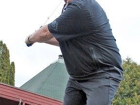 Scott Hatchard, the new manager of the Pinewood Park Golf Club, takes a swing at the driving range, Thursday. Heavy rain in the North Bay area Wednesday, with more expected today, has pushed back plans for course openings across the district to late next week at the earliest.
Dave Dale / The Nugget