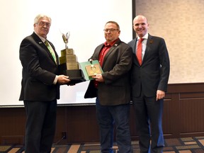 Coun. Paul Smith (centre) accepts the Builders of the Yellowhead Award for his work with the Trans Canada Yellowhead Highway Association, as he now gets ready to take on the role of president with the organization.

Photo Supplied