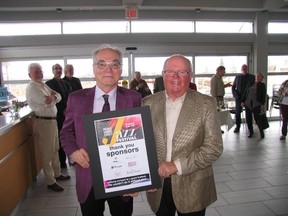 Jack Evans/For The Intelligencer
Prince Edward County Jazz Festival creative director Brian Barlow and chairman John Puddy hold a poster promoting this summer’s annual festival during a media meeting in the Huff’s Estates Winery.