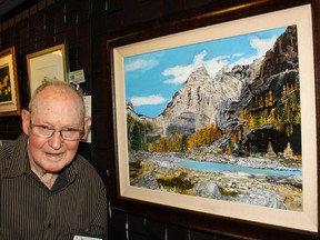 Cochrane art legend Glen Boles shows off one of his pieces during last year's Show and Sale at the RancheHouse. While he's not submitting any works in this year's show, he will still be in attendance.