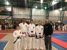 From left to right- Graeme Galliott (won bronze in patterns and silver in sparring), Tim Wuthrich (won a bronze in patterns), Derek Boot (won a bronze in sparring) and Derek Lenson and coach Cam Macdonald of Trinity Taekwon-Do at the  ITF Western Canadian Championships Apr. 20-21 in Regina Sask.