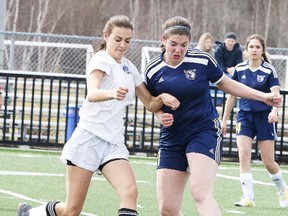 Silvanna Vitello of the Marymount Academy battles for the ball with Katryna McLeod of College Notre Dame during senior girls high school soccer action in Sudbury, Ont. on Thursday May 3, 2018. Gino Donato/Sudbury Star/Postmedia Network