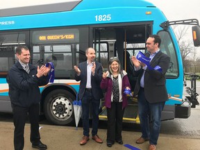 Kingston Transit Director of Transit and Fleet Services Jeremy DaCosta, left, Kingston Mayor Bryan Paterson, Kingston and the Islands MPP Sophie Kiwala and Kingston and The Islands MP Mark Gerretsen celebrate the launch of the new 801/802 express route on Friday.  (Brigid Goulem/For The Whig-Standard)