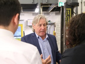 Dennis Centis, senior partner of Centis Tile and Terrazzo Inc., gives a tour of the facility on Falconbridge Road on Friday. A number of business representatives gathered at Centis for an investment announcement through the Northern Ontario Heritage Fund Corporation. (John Lappa/Sudbury Star)