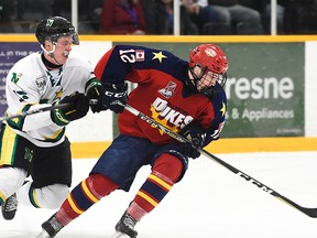 Belleville native Daniel Panetta of the Wellington Dukes protects the puck from Thunder Bay North Stars foe Kyle Auger during the 2018 DHC semi-final contest Friday night in Dryden. Dukes were 6-3 winners and advance to tonight's final vs. Dryden. (Andy Corneau/OJHL Images)