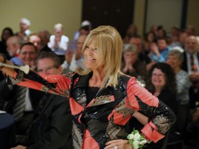 Patti Davey high-steps her way to the podium for her induction into the Owen Sound Sports Hall of Fame. The national champion twirler formed her own majorette corps, the Owen Sound HighSteppers, and within a year and a half the membership grew to 125 with seven drum majors and a drum and flag corps all under her tutelage. Over a four year period, Davey and her teams earned 57 trophies all while representing the city of Owen Sound including provincial and national championships. Greg Cowan/The Sun Times