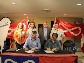 Fort McMurray Metis Local 1935 leaders sign a partnership agreement with Imperial Oil executives at a Local monthly meeting on May 5, 2018. Laura Beamish/Fort McMurray Today/Postmedia Network