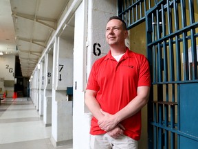 Geoff Waycik, director of historic sites for the St. Lawrence Parks Commission, is seen inside Kingston Penitentiary G Range. The popular tours are starting up again on Wednesday May 9. (Ian MacAlpine/The Whig-Standard/Postmedia Network)