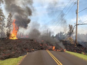 This image released by the U.S. Geological Survey shows lava from a fissure slowly advancing to the northeast on Hookapu St. in Leilani Estates, Hawaii. AFP/Getty Images