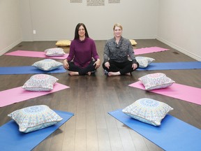 Sherri Winsa, left, and Jenny Anderson are involved in a children's program on mindfulness. (John Lappa/Sudbury Star)
