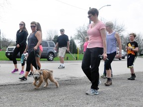 Participants in the Mitchell Hike for Hospice this past Sunday, May 6, including four-month-old pup Wally being walked by Fiona Kipfer, begin the 4.4 kilometre route at Mitchell’s Lions Park. ANDY BADER/MITCHELL ADVOCATE