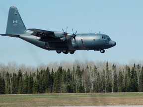 A C-130 "Hercules" transport aircraft is seen landing at the Victor M. Power Airport in Timmins in this March 2007 photo. The Canadian Armed Forces sent a Hercules to Kashechewan Monday morning to pick up some of the residents who had yet to be evacuated. The evacuation is underway due to the rising threat of flooding.

LEN GILLIS/The Daily Press file photo