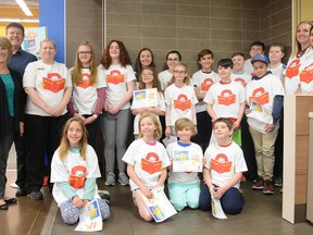 Students hold their certificates for Ronald’s Readers at the Walmart McDonalds in Whitecourt on May 3 (Peter Shokeir | Whitecourt Star).