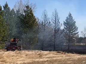 Strathcona County fire crews, pictured putting out a grassfire in the rural area this weekend, responded to 10 fires leading up to a fire ban implementation on Monday.

Twitter Photo