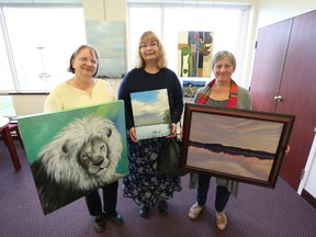 Marion Morgan, Loring Bonser, and Suzanne Hussey are three of five artists displaying at the Napanee branch of the Lennox and Addington County Library through the spring and summer. Also on display are Gerry Hogaboam and Kristen Lipson. Meghan Balogh/The Whig-Standard/Postmedia Network