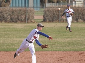 Knights shortstop Justin Mabley throws to first base in time to get an out at first base during a J.T. Foster home game last Thursday against Okotoks’ Foothills Composite. Stephen Tipper Nanton News