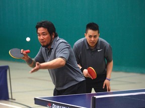 Gordon Andersn/Daily Herald- Tribune
Butch Songahid sets up for a serve while teammate Edward Ramos looks on. The pair participated in the Table Tennis Tournament at the Eastlink Centre this past Saturday. The duo were part of the team category winner.