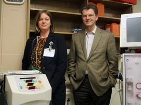 Steph Crosier/Postmedia Network
Lori Van Manen, director of the renal and palliative care services at Kingston Health Sciences Centre and regional director of the south-east Ontario Renal Network, and Dr. David Holland, Head of Nephrology at Kingston General Hospital, with an at-home dialysis machine on the left and an in-hospital dialysis machine on the right at KGH in Kingston.