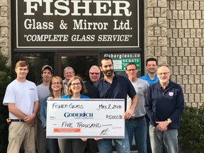 New owners, Liz and Sam Chamas (centre holding cheque), along with Mike Moody, Andrew Ryan, Joni Reinhart, Bill Pollock and Brad Chase present the Fisher Glass donation to members of the Recreation Park Committee.The Chamas family and Fisher Glass donation was $5,0000.  (Contributed photo)