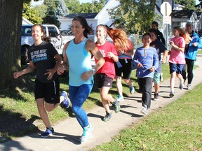 Kerri Wood, front right, leads a group of Victor Lauriston Public School students out for a run in Chatham, Ont. on Friday October 14, 2016, as part of a pilot project to improve the health of students. (Ellwood Shreve/Chatham Daily News)