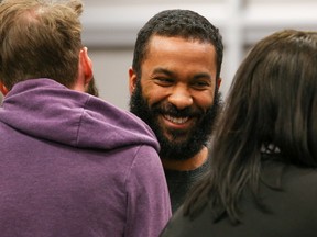 Joshua Blake, co-owner of JERKebago lnc, smiles as he's congratulated by supports following a decision by council to approve the operating license for his food trailer for the 2018 season on Monday May 7, 2018 in Quinte West, Ont. Tim Miller/Belleville Intelligencer/Postmedia Network