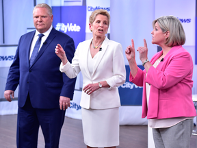 Liberal Premier Kathleen Wynne, centre, Progressive Conservative Leader Doug Ford, and NDP Leader Andrea Horwath at the Ontario Leaders debate in Toronto on May 7, 2018. FRANK GUNN/THE CANADIAN PRESS