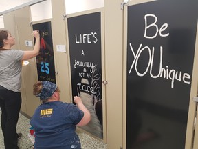Parents, friends, students, the principal and vice-principal of St. Charles in Chelmsford recently created artwork in the bathrooms at the school. Supplied photo
