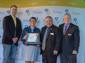 City council members and members of the Community Services Advisory Board pose with the Parade and Fireworks Committee who received the Volunteer Advocate Award. (Photo by Kelsey Yates/Airdrie Echo/Postmedia Network)