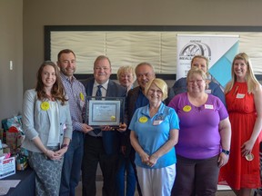 City council members pose with volunteers from Meals on Wheels at the volunteer appreciation ceremony. May 2 was proclaimed Meals on Wheels day in recognition of 35 years of service.