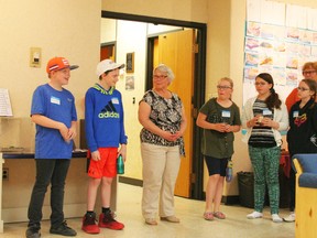 Artists in School program student ambassadors were there to explain the art and how they created it: Carter Zavisha, Ethan Fischer, Ashlyn Crane, Kallie Earle and Hailey Graham were introduced by Artists in School program coordinator Doreen Verschoor (centre)