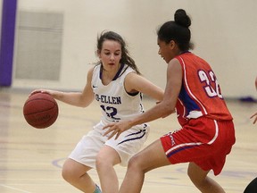 Tayna Fairwell  of the Macdonald Cartier Pantheres keeps in close check with Mireille Di Maio of the Lo Ellen Knights during senior girls high school basketball action in Sudbury, Ont. on Tuesday September 26, 2017. Gino Donato/Sudbury Star/Postmedia Network