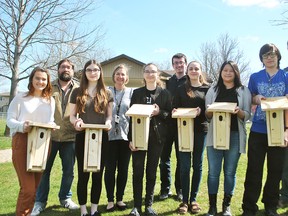 Chatham-Kent Secondary School students presented the Lower Thames Valley Conservation Authority with bird houses they constructed. Shown in the photo are Ainsley Shaw, teacher Gord Williams, Chloe Funnell, teacher Meredith Grainger, Sydney Shaw, Eric Smyth, Katrina Vitek, Caroline Harwood, Elijah Brundritt and Greg Van Every, environmental project manager with the conservation authority. Tom Morrison/Chatham This Week