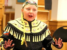 Neveah Pine, a Grade 6 student at East View Public School, gestures while she gives her speech about her jingle dress to Algoma District School Board trustees on Tuesday night.