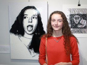 Camea Waldoch, a Grade 11 student at Northern Collegiate, poses with her glitter-based self-portrait, Face of a Murderer, at the launch of the Fast Forward Exhibition at Gallery in the Grove on April 29.
CARL HNATYSHYN/SARNIA THIS WEEK