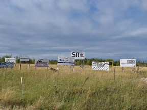 Signs advertising rural businesses line Highway 881 near the entrance of Conklin, Alta., on Monday, Sept. 11, 2017. Cullen Bird/Fort McMurray Today/Postmedia Network