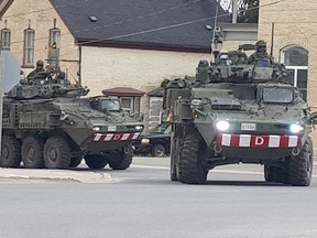 About a dozen Canadian Forces armoured vehicles rolled through Tiverton Sunday afternoon, May 6, 2018 to smiles and waves from onlookers. The soldiers atop the military vehicles waved back as they rounded the corner and continued up Highway 21. (Troy Patterson/Kincardine News and Lucknow Sentinel)