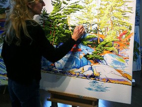 Margarethe Vanderpas works on one of her paintings in her studio in Stratford. As part of the 2018 Stratford Studio Tour, Vanderpas and 18 other Stratford artists will display their work at studios and other venues through the city’s downtown. (Submitted photo)