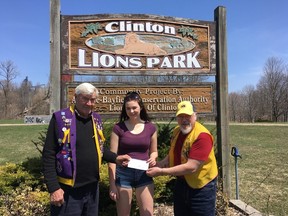 Clayton Groves (left) and Carl Merner of the Clinton Lions Club present Alexis Merner with a $500 cheque to go towards her expenses for her three-week volunteer trip. (PHOTO COURTESY OF TANYA MERNER)