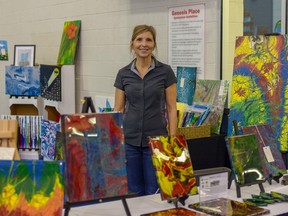 Artist Pamela Jonson shows off her art collection at the Airdrie ARTS Society Spring Art Show & Sale on April 28 and 29. Jonson specializes in acrylic pouring, which has become a very popular medium that new artists are eager to learn.