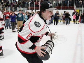 Owen Sound's Jakob Lee celebrates with the Sutherland Cup following the Listowel Cyclones first provincial title win. Cory Smith/The Beacon Herald