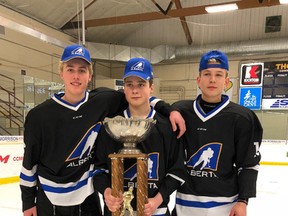 Rhett Parsons, Ty Mueller, Sam Vincent (from left to right)- holding the Alberta Cup after they helped Team Central win the tournament in Spruce Grove.