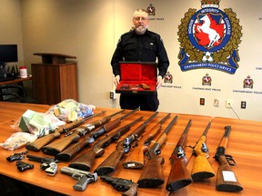 Chatham-Kent police firearms officer Const. Rob Tobin displays some of the firearms and ammunition turned in during a gun amnesty held during the month of April. Photo taken in Chatham, Ont. on Wednesday May 9, 2018. (Ellwood Shreve/Chatham Daily News)