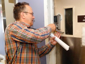 Luke Hendry/The INtelligencer
Quinte Health Care director Joseph Mancuso locks a door of a fire-damaged kitchen at Belleville General Hospital Wednesday in Belleville. Though contained to one room, the fire caused significant damage and patients may have to remain on other floors for about a week.