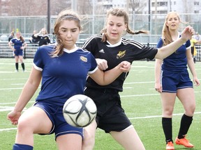 Fallon Streitenberger of the Bishop Alexander Carter Gators battles for the ball with Sara Boucher of the Lively Hawks during senior girls division 2 high school soccer action in Sudbury, Ont. on Wednesday May 9, 2018. Bishop Alexander Carter defeated Lively 1-0.Gino Donato/Sudbury Star/Postmedia Network