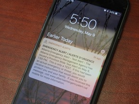 An Apple iPhone receives the emergency alert test from the Alberta Emergency Management Agency in Fort McMurray, Alta. on Wednesday, May 9, 2018. Vincent McDermott/Fort McMurray Today/Postmedia Network