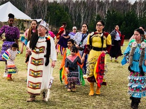 Elder Jeanne Naponse takes part in a powwow with Indigenous dancers as well as students from the Sudbury Catholic District School Board on May 9.