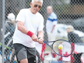Victor Zablotni hits the ball at the Canmore Tennis Association’s opening day at the Lion’s Club tennis courts in Canmore on Sunday. Pam Doyle/ pamdoylephoto.com